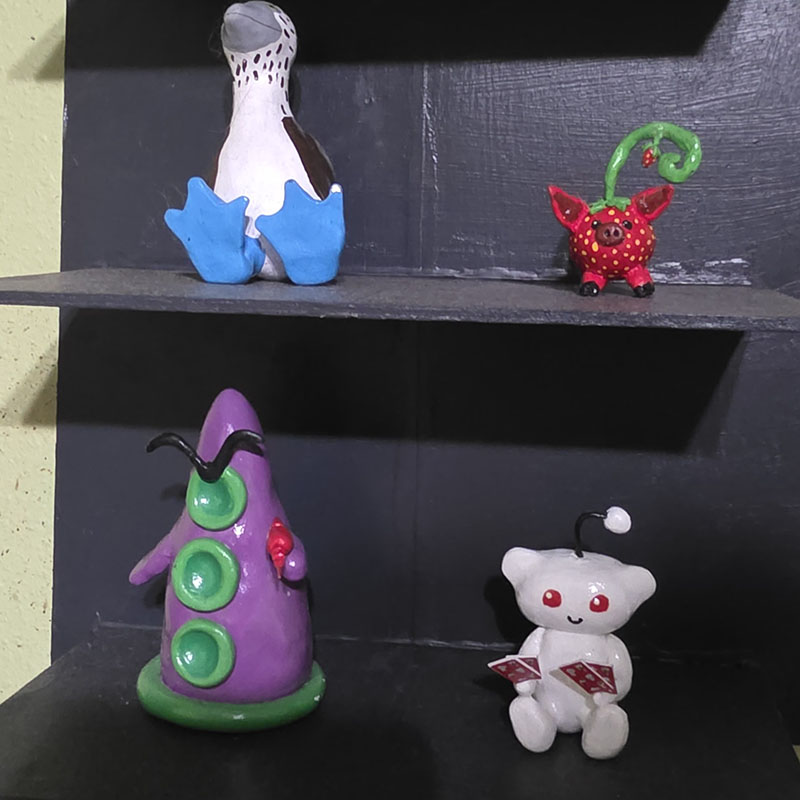 Various Clay Creations on a Dollar Tree Made DIY Shelf